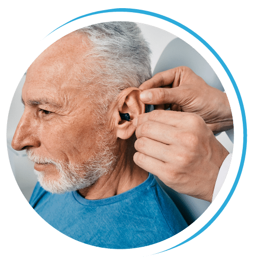 Man at his audiologist getting his hearing aids fitted