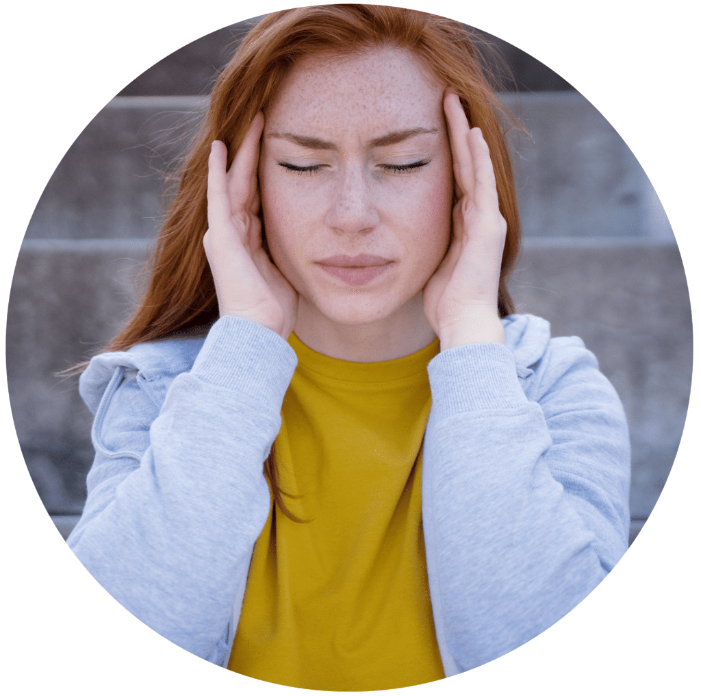 Woman in discomfort from tinnitus